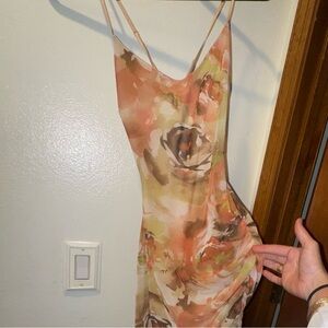 Asymmetrical strappy dress with floral sheer lining